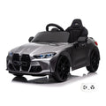BMW M4 grise, voiture électrique enfant 12V, vue trois quarts avant avec sa télécommande