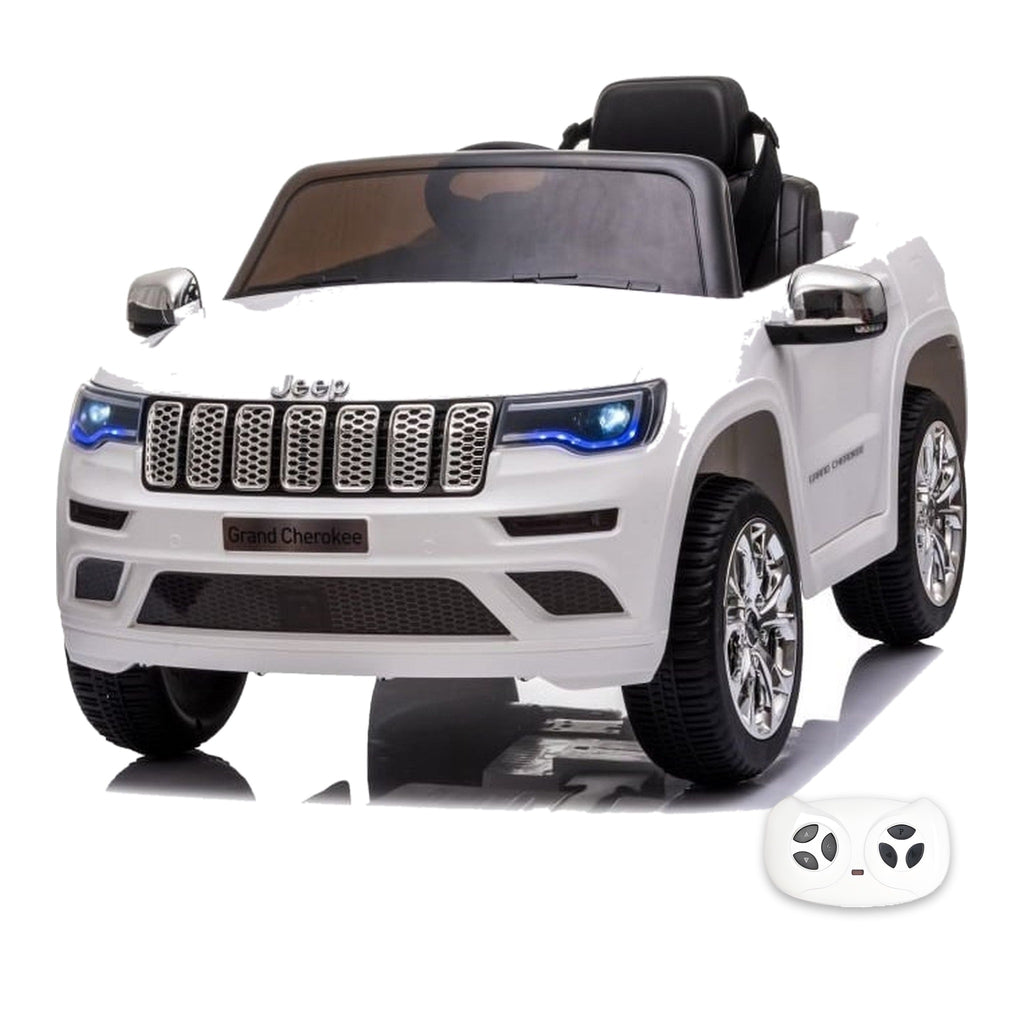 Jeep Grand Cherokee blanche, voiture électrique enfant 12V, vue trois quarts avant avec sa télécommande