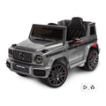 Mercedes G63 AMG gris, voiture électrique enfant 12V lithium, vue trois quarts avant avec sa télécommande